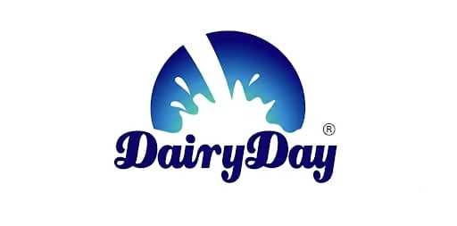 Dairy Day logo featuring blue splashing milk with registered trademark symbol